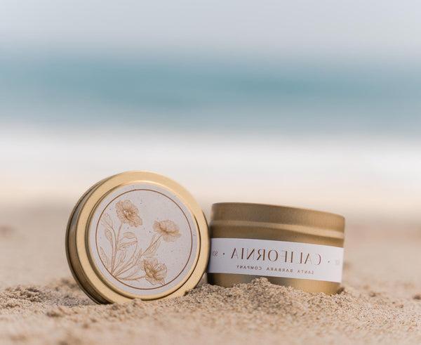 California Candle with California Poppy Lid Design on the beach